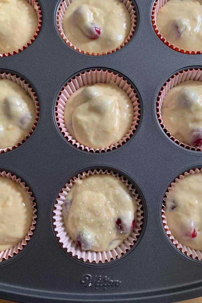 cranberry orange muffin batter in pan