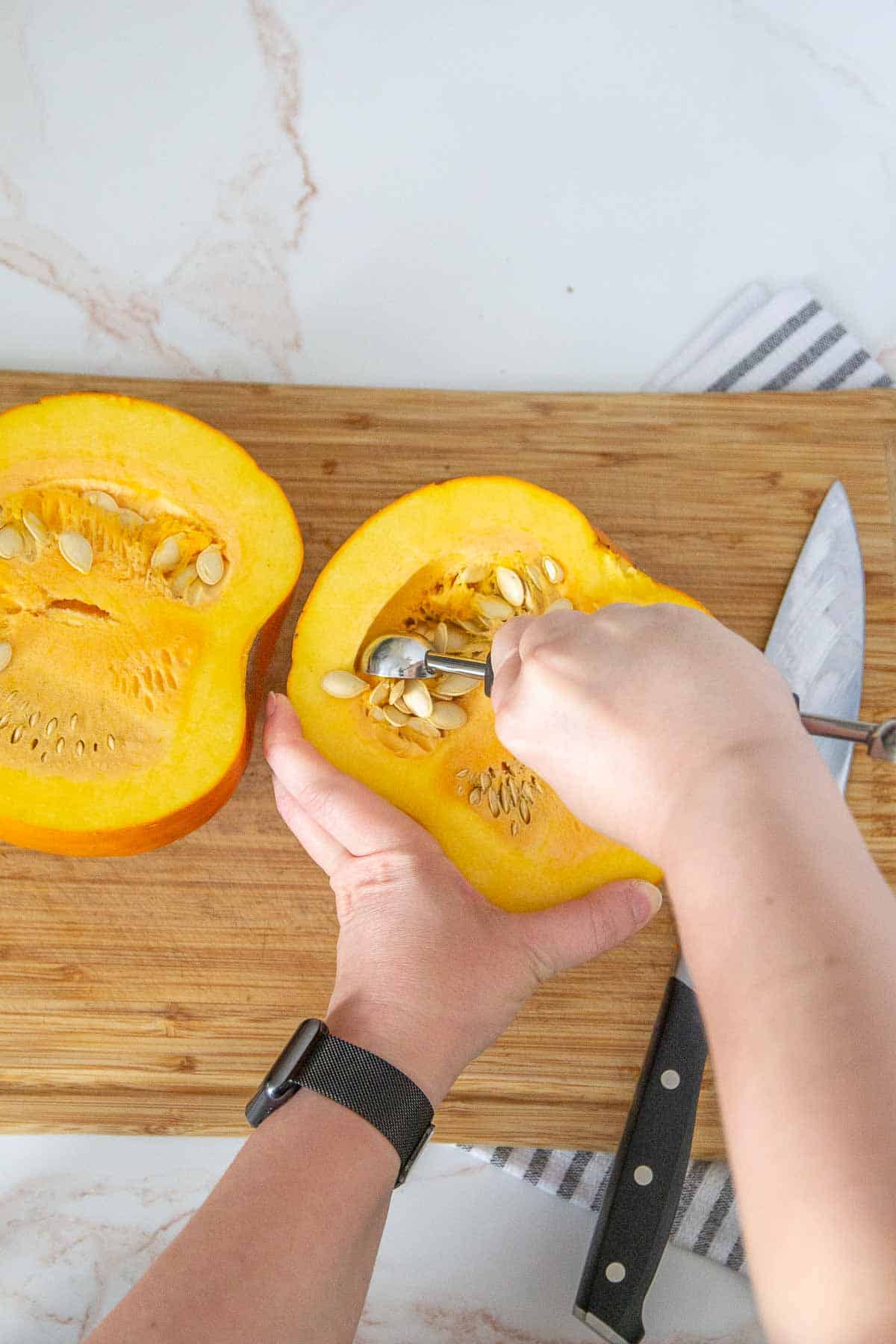 removing seeds from pie pumpkin with melon baller