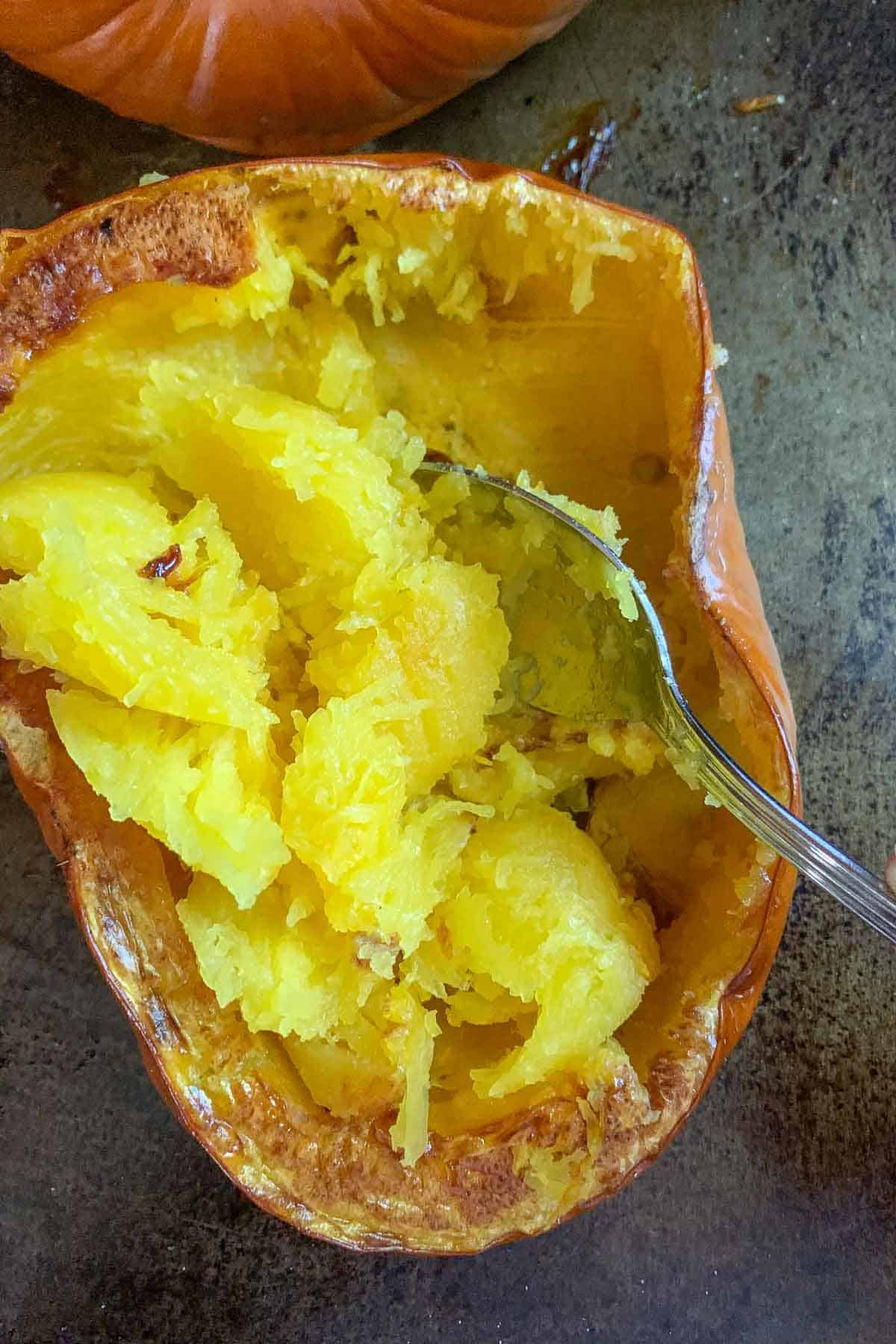 scraping roasted pumpkin from skin