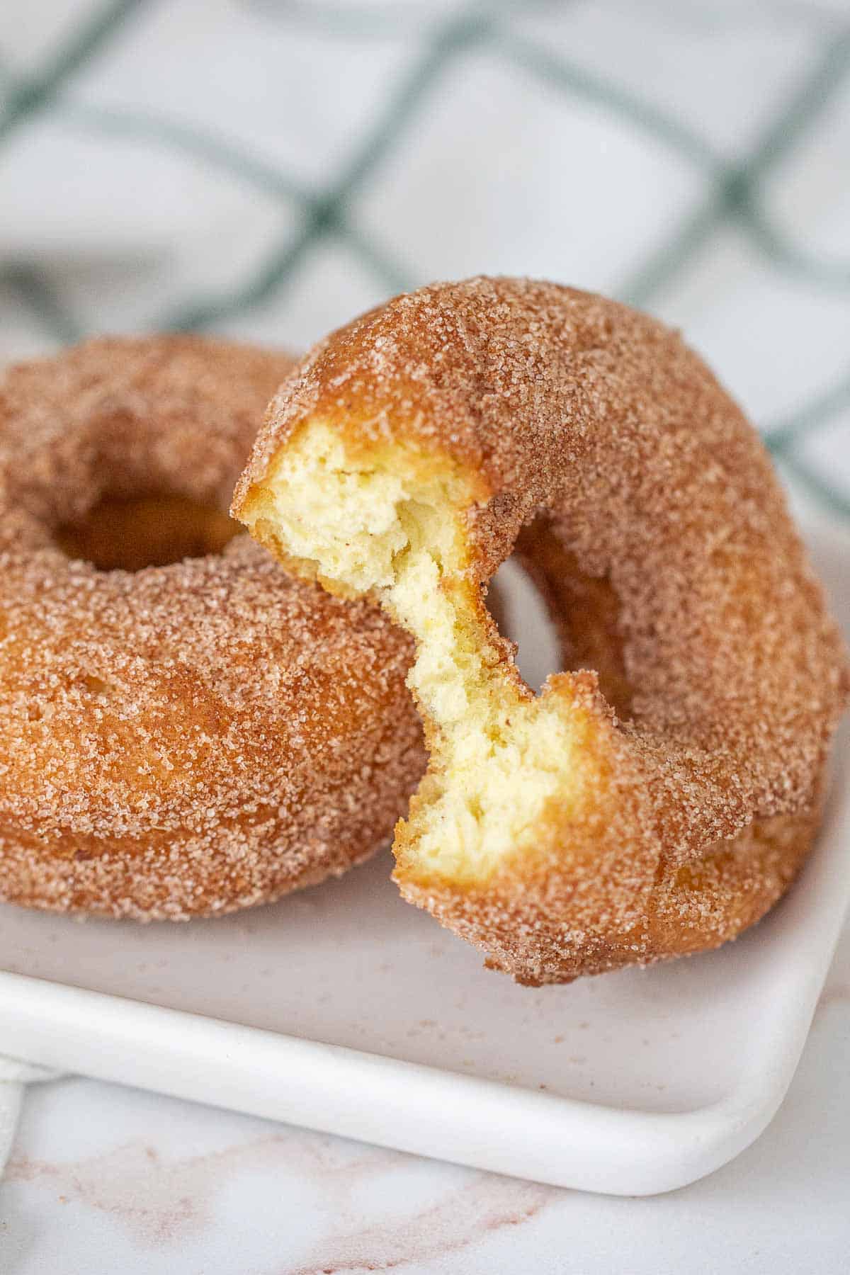 close up of pumpkin donut with bite out