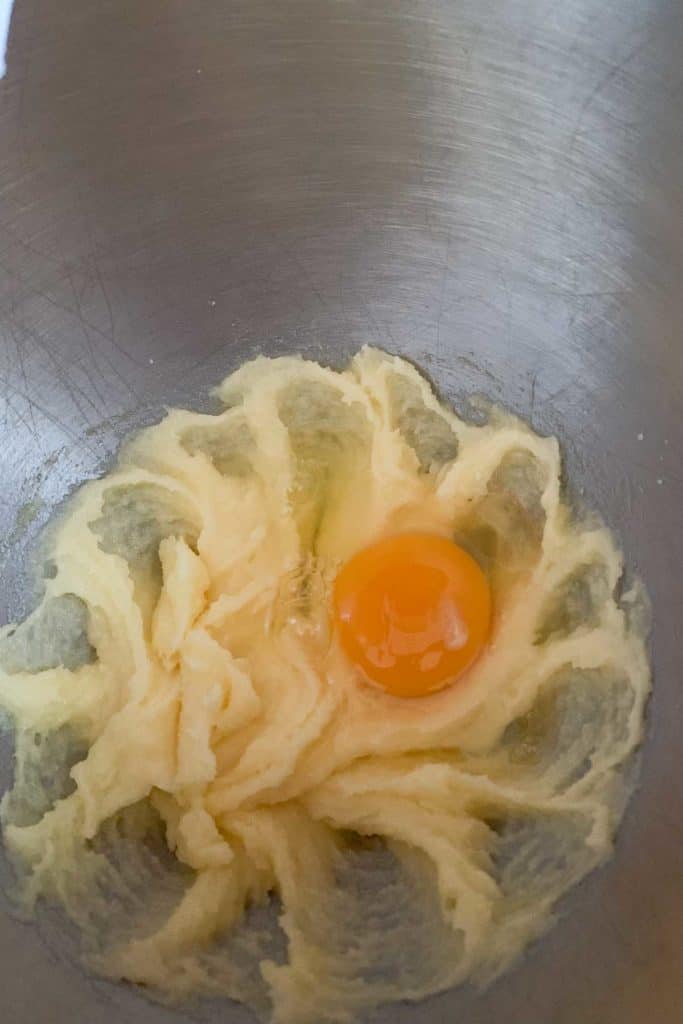 adding egg to butter and sugar
