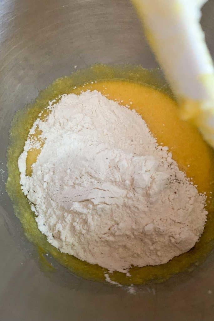 adding flour to donut dough