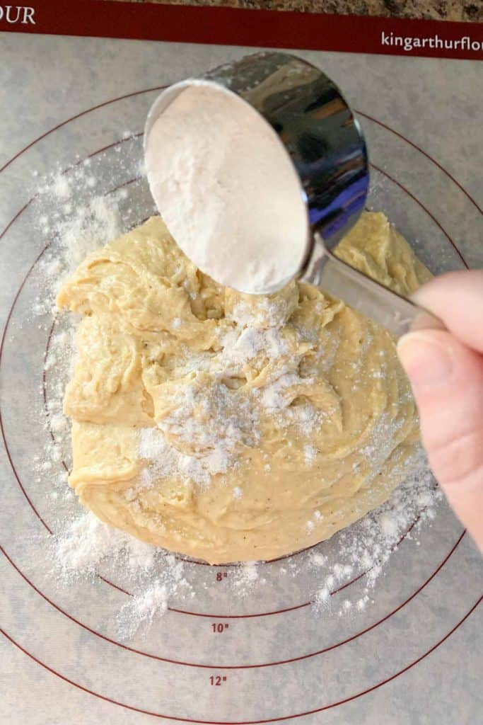flouring donut dough