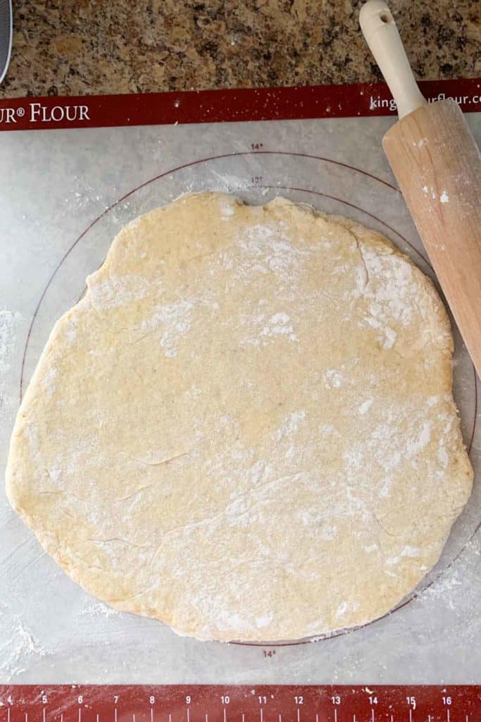 rolling out donut dough