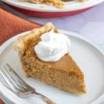 slice of butternut squash pie on plate with fork