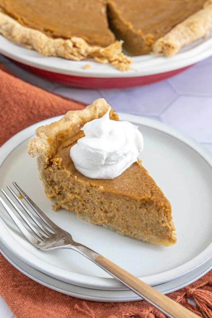 slice of butternut squash pie on plate with fork
