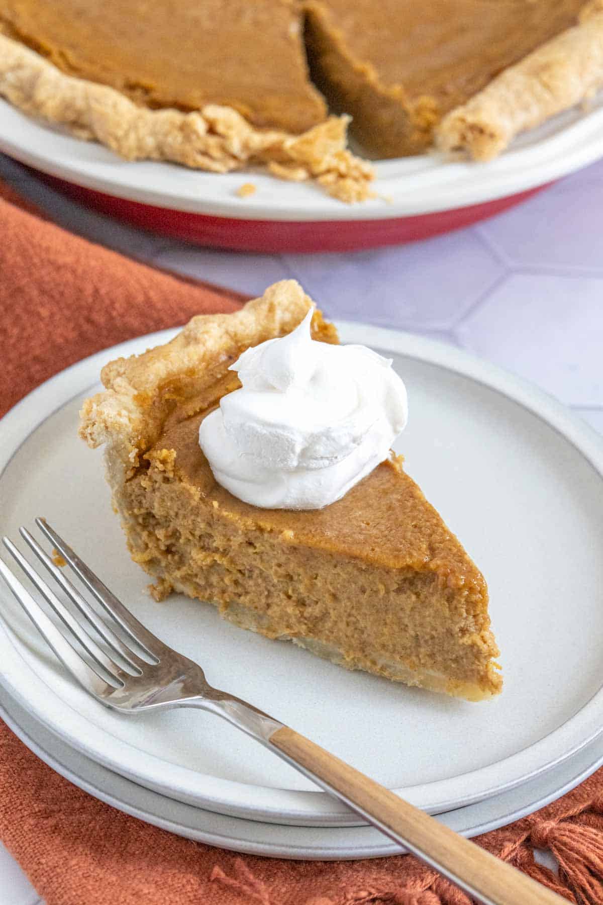 slice of butternut squash pie on plate with fork