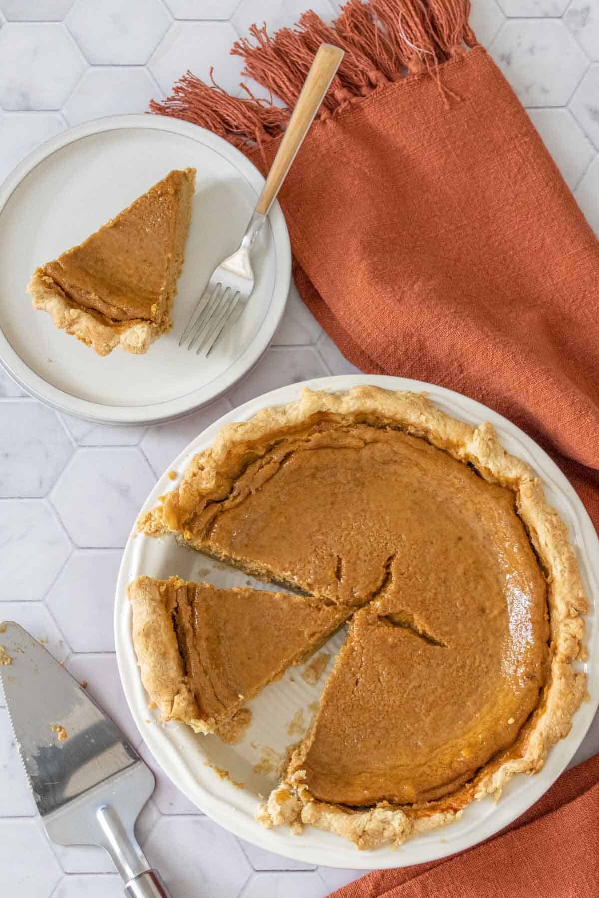 overheat butternut squash pie sliced with a slice on a plate
