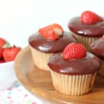 cake plate with chocolate covered strawberry cupcakes