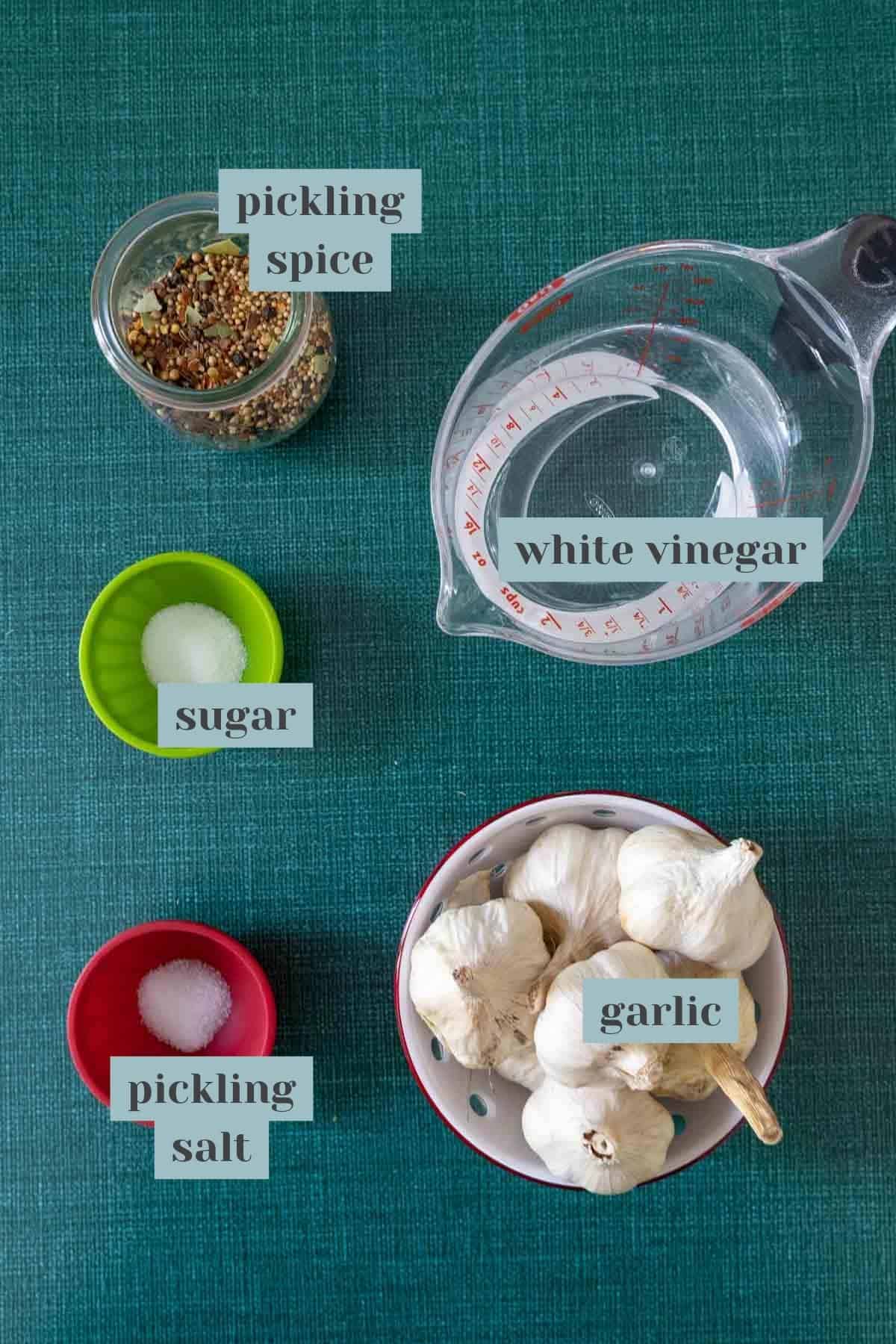 ingredients for pickled garlic with labels