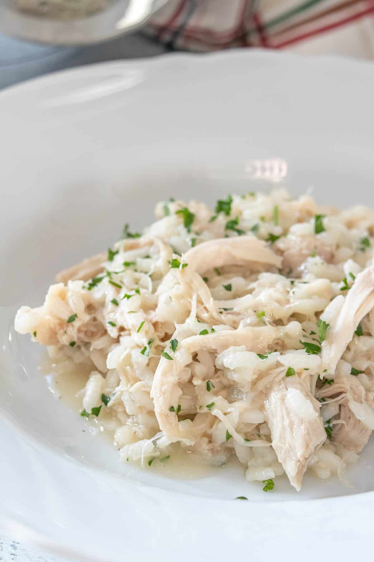 Chicken risotto in a white bowl.