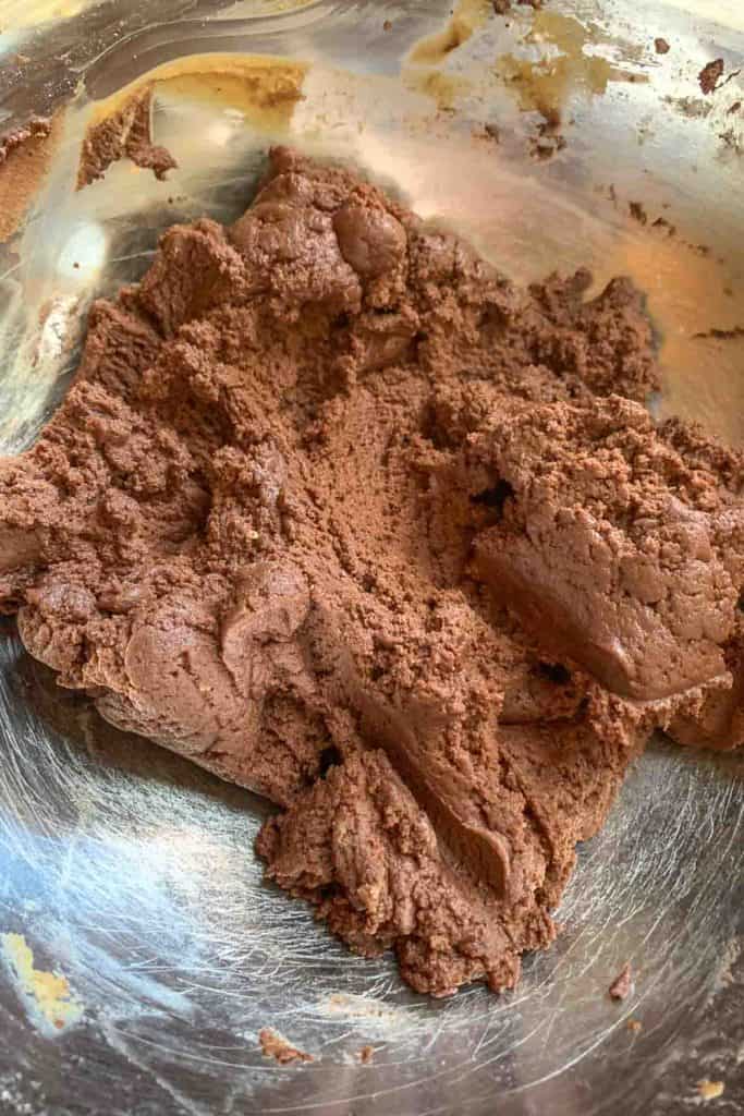 Filling for peanut butter pie before adding whipped cream in a mixing bowl.