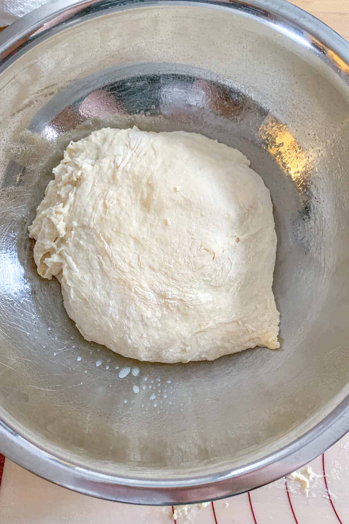 Mixed English muffin dough in a bowl before rising.