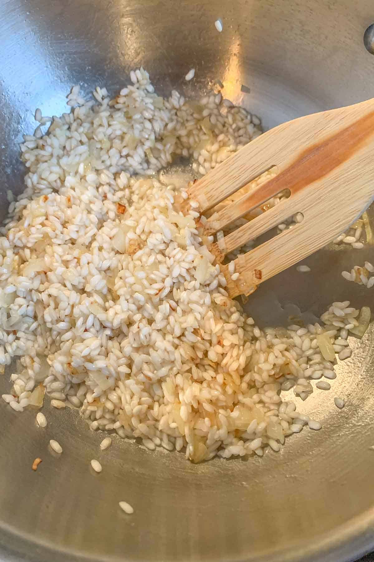 Sauteeing arborio rice for risotto.