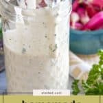 A mason jar filled with creamy ranch dressing and a spoon, with fresh radishes and parsley in the background. Text overlay reads "homemade ranch dressing." Perfect for dipping or drizzling, this classic ranch dressing elevates any meal.