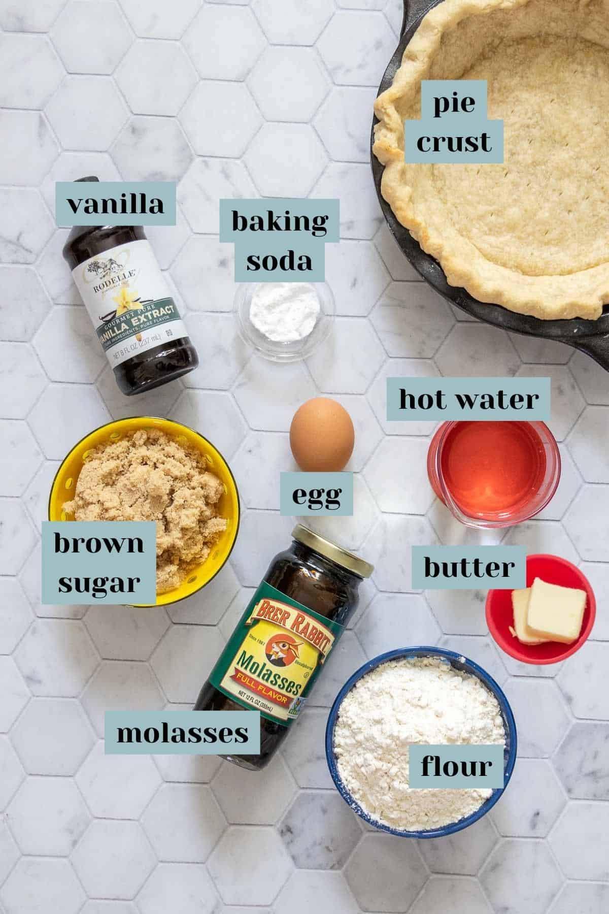 Ingredients for shoofly pie on a tile surface with labels.