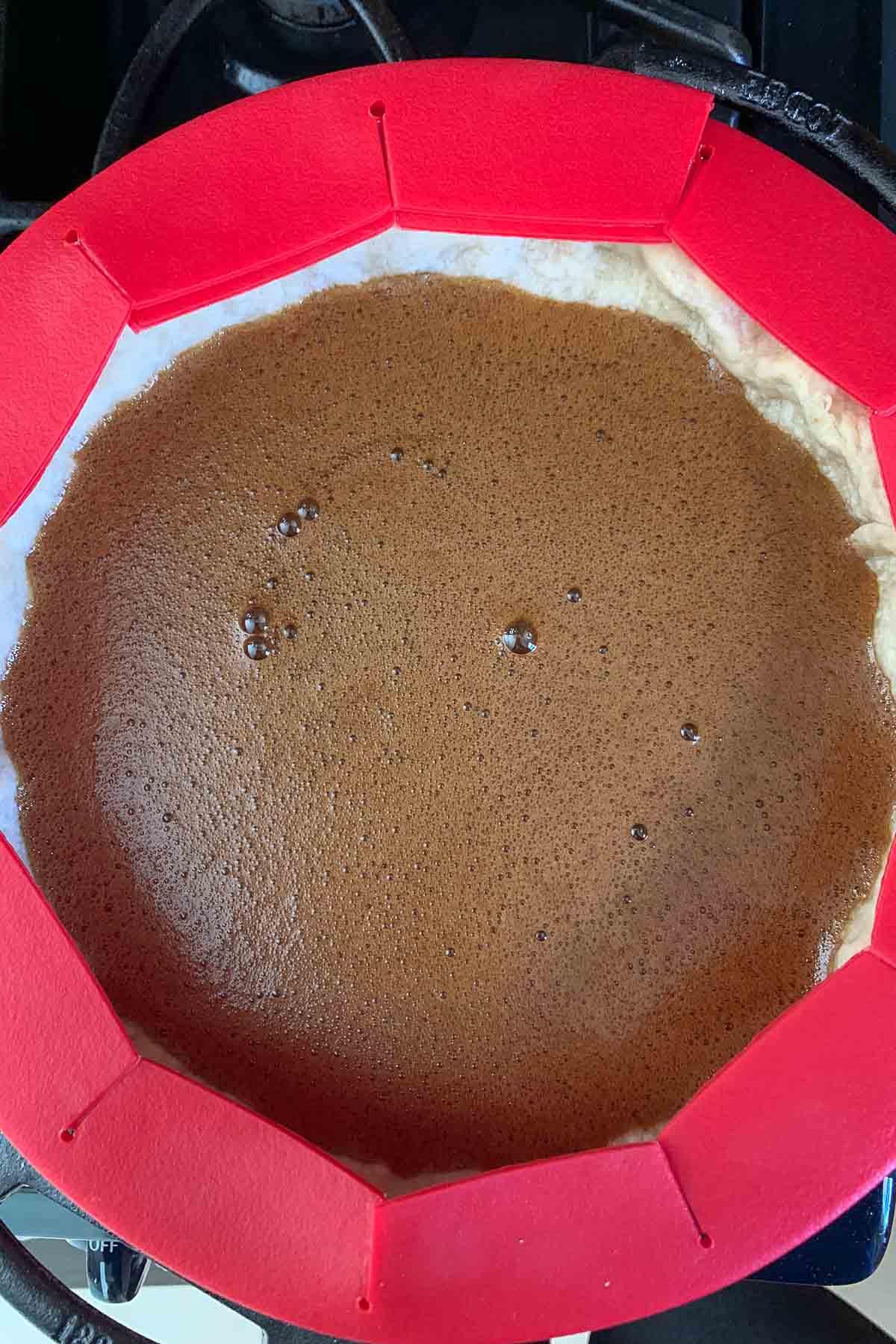 Wet filling for shoofly pie in a pie crust.