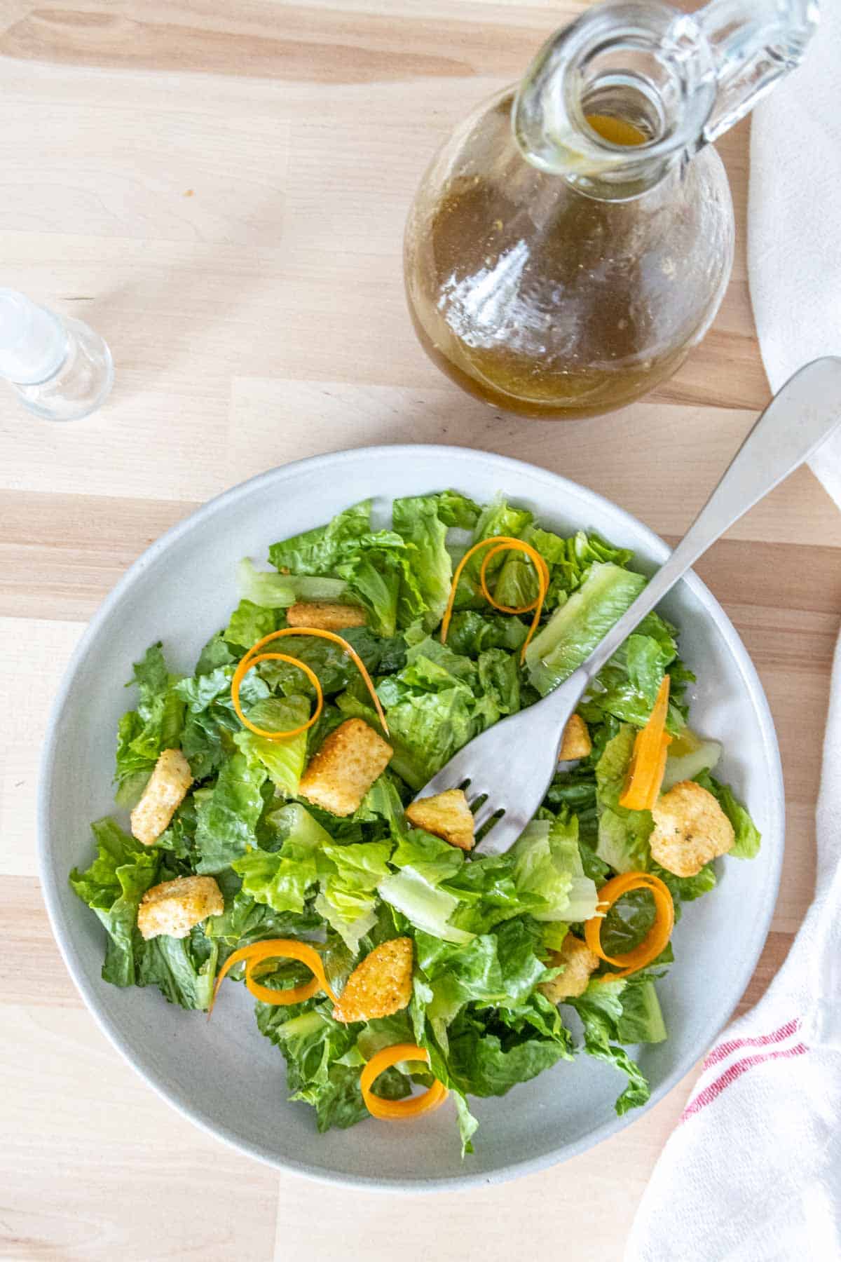 Overhead of salad with balsamic vinaigrette on it.