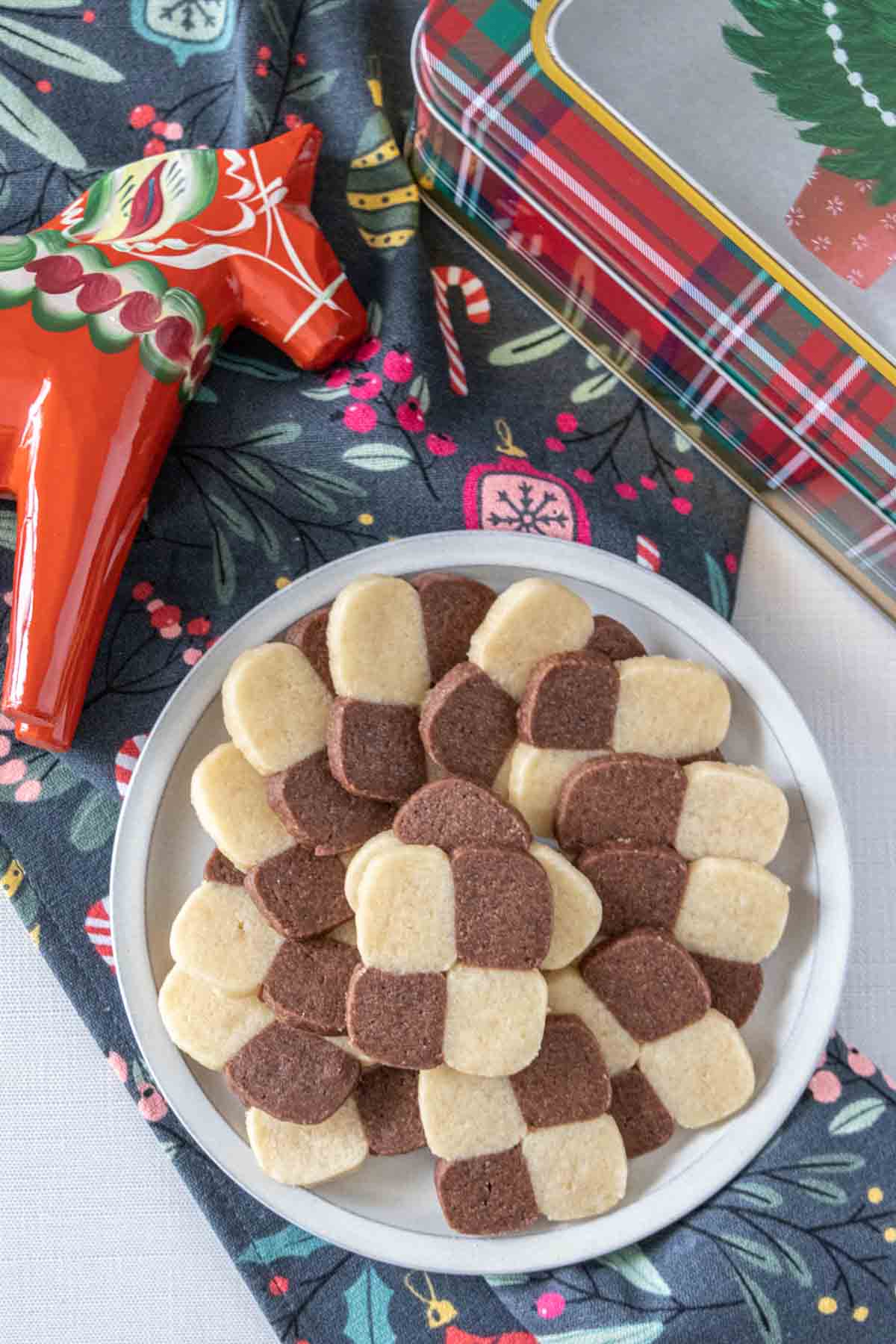 Overhead of plate of checkerboard cookies.