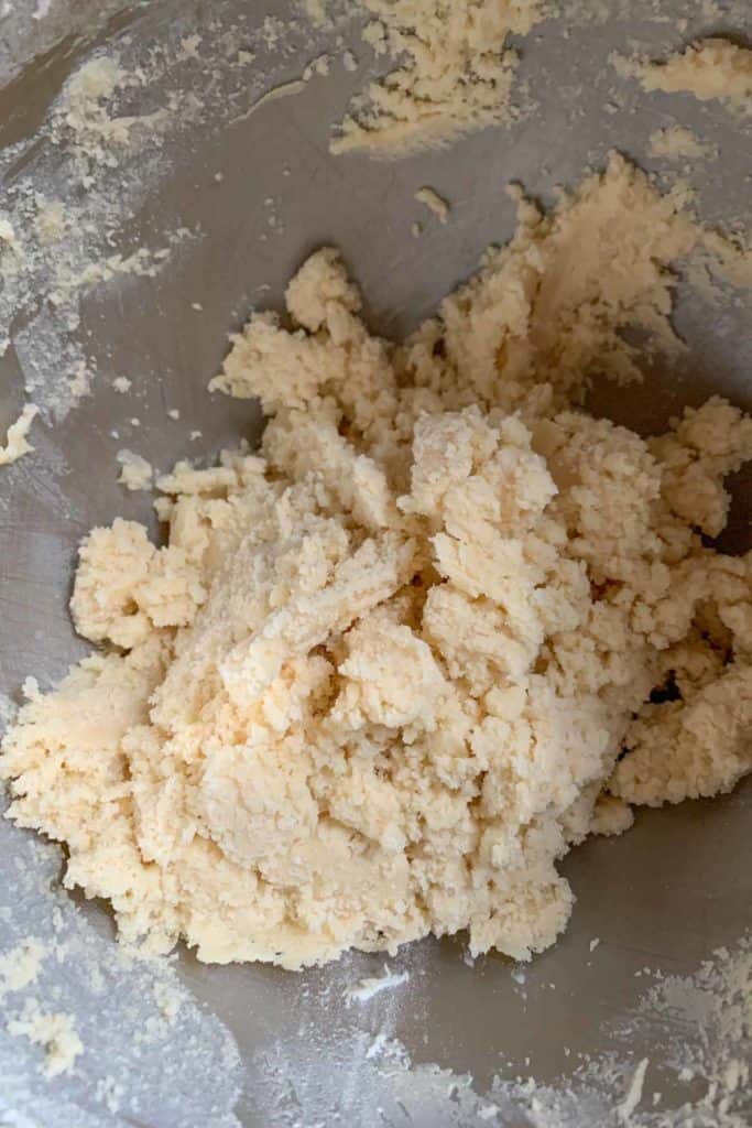 Mixed checkerboard cookie dough in a bowl before kneading.