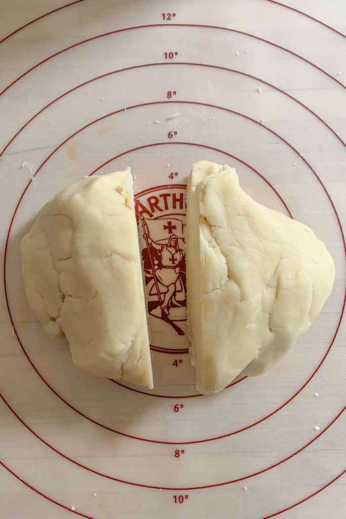 Checkerboard cookie dough divided in half.