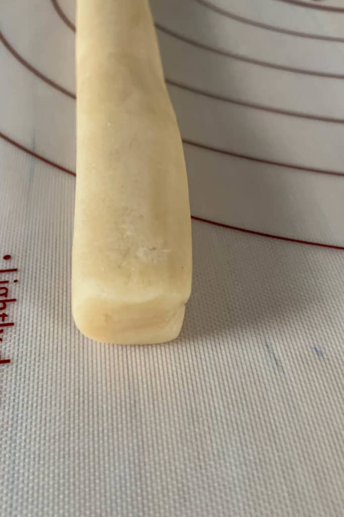 Shaped log of vanilla cookie dough for checkerboard cookies.