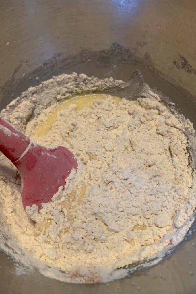 Mixing batter together for cranberry coffee cake.
