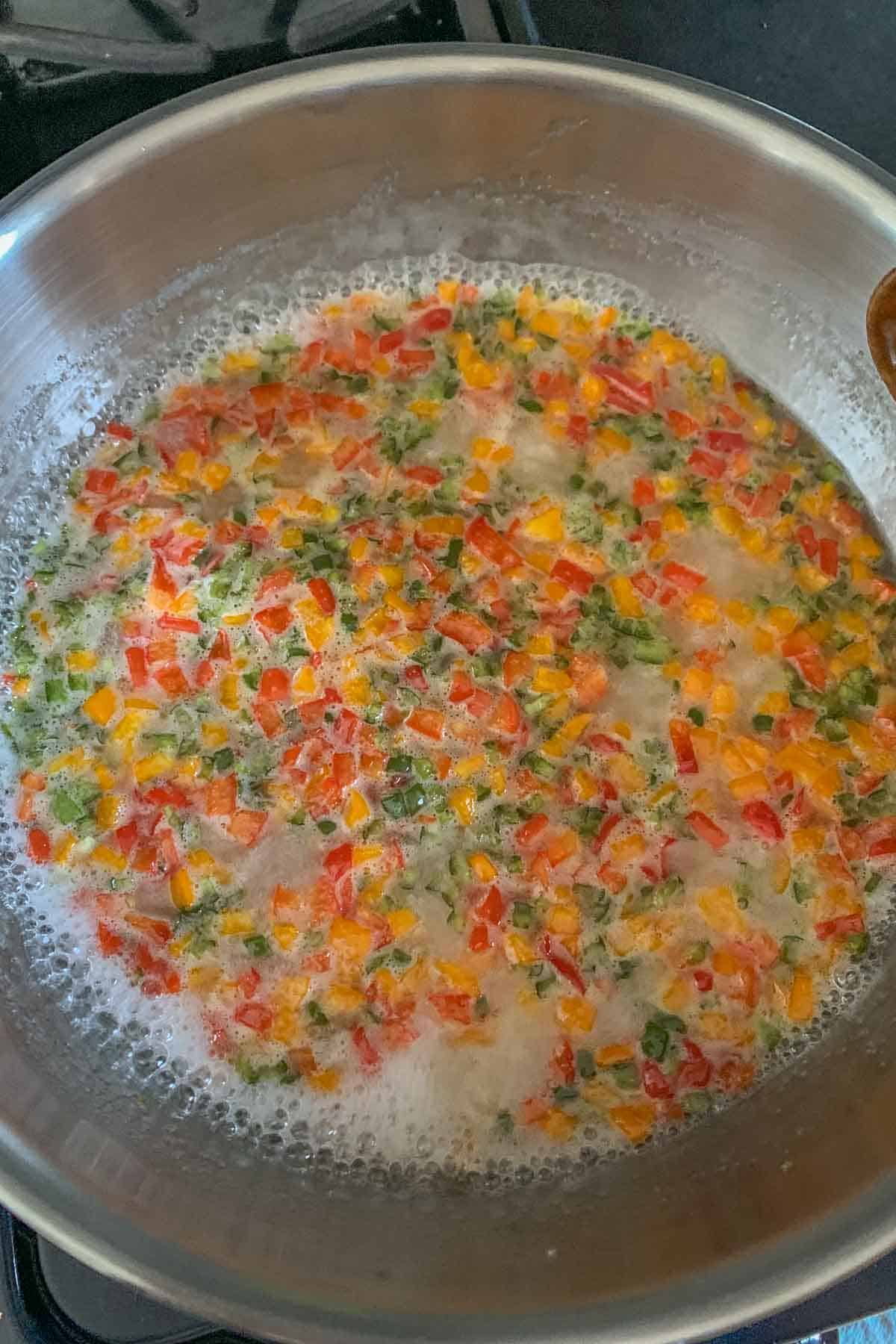 Boiling jalapeño jelly in a stainless pan.