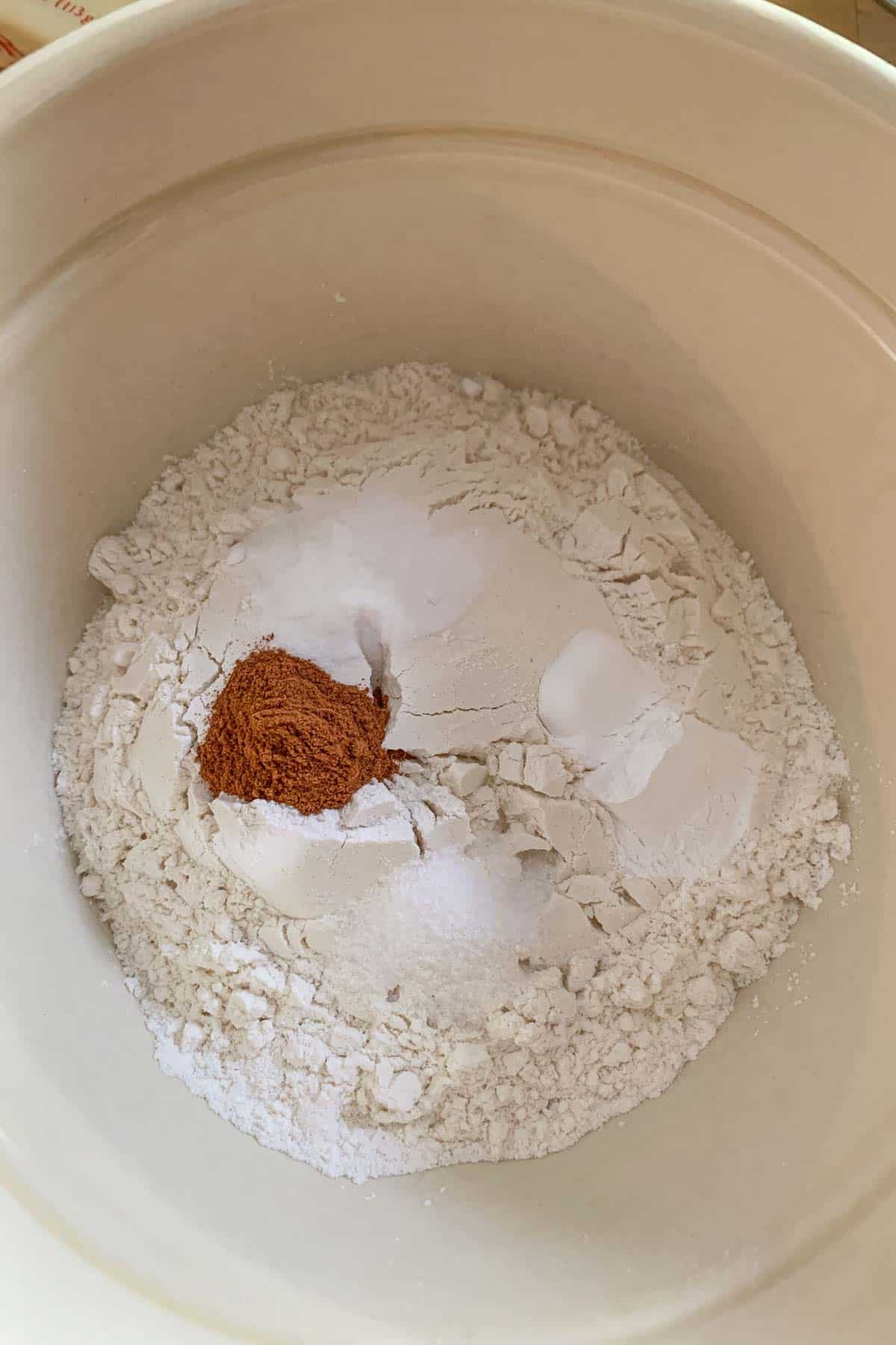 Dry ingredients for banana bread in a mixing bowl.
