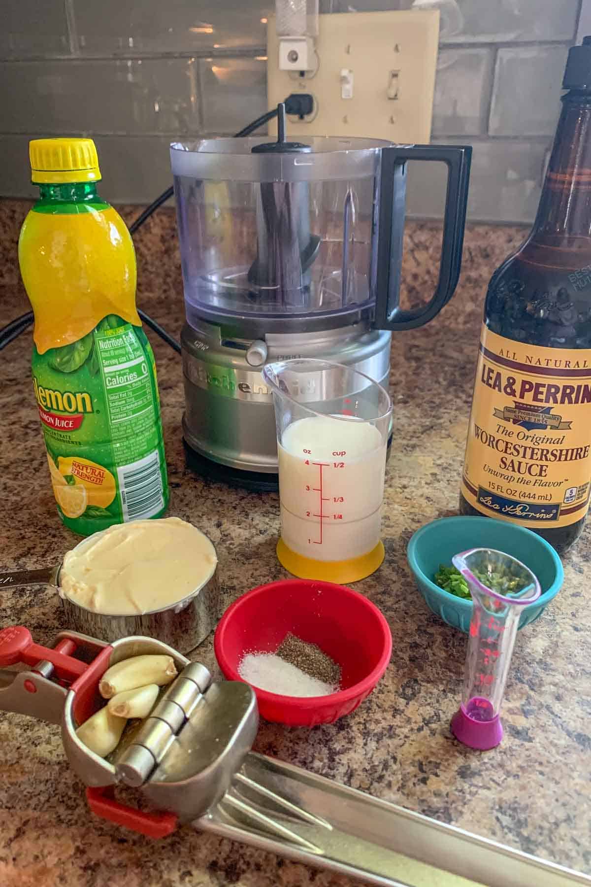 Ingredients for garlic dressing on a kitchen counter.