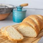 Sliced French bread on a cutting board.