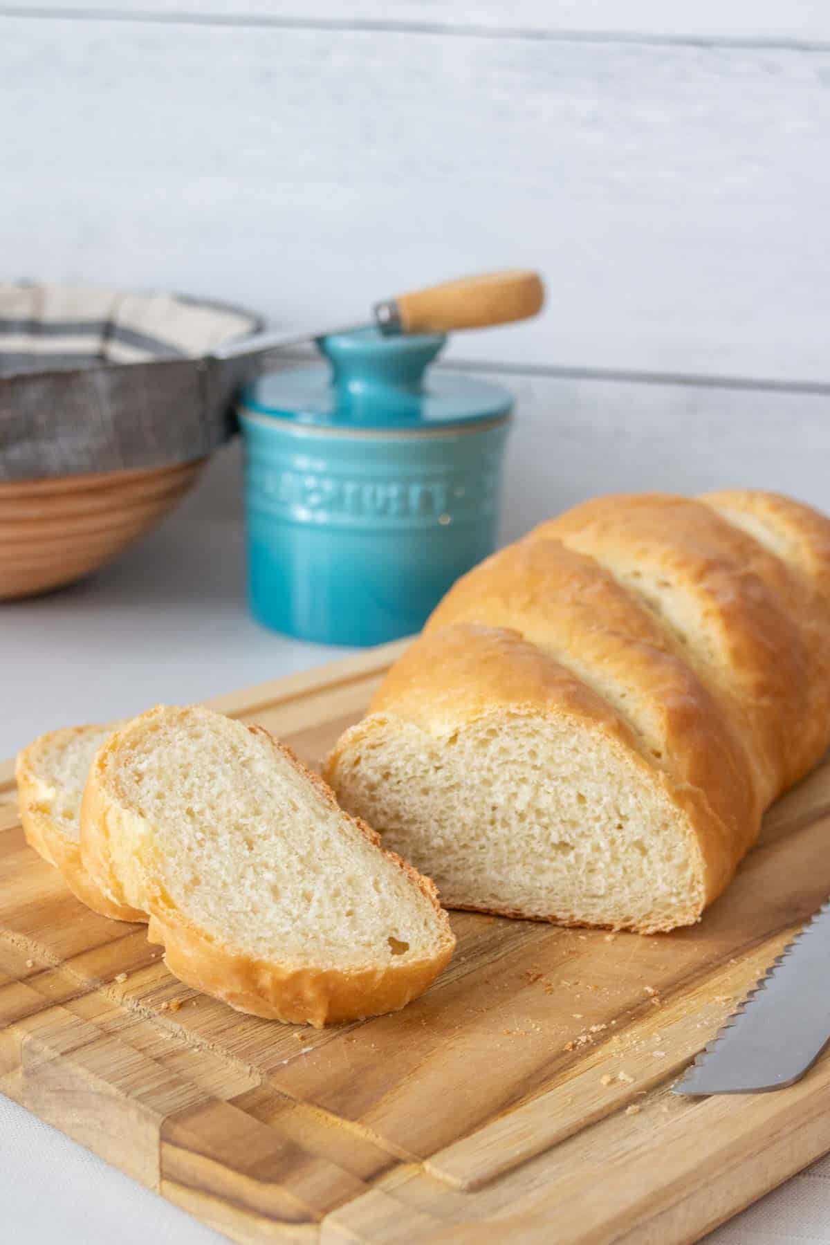 Sliced French bread on a cutting board.