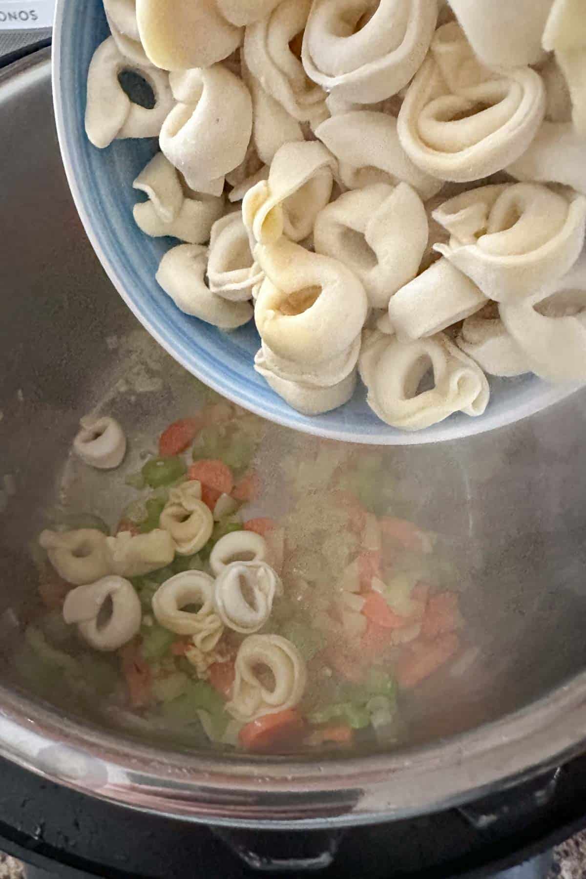 Adding frozen tortellini to instant pot for soup.
