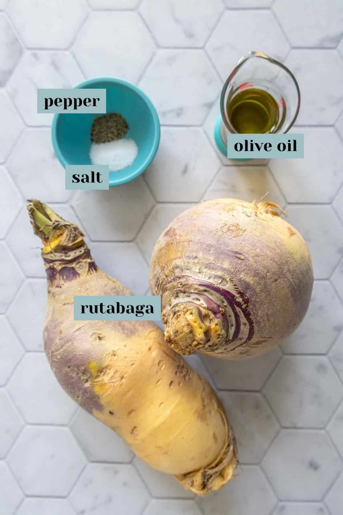 Ingredients for roasted rutabaga on a tile surface with labels.