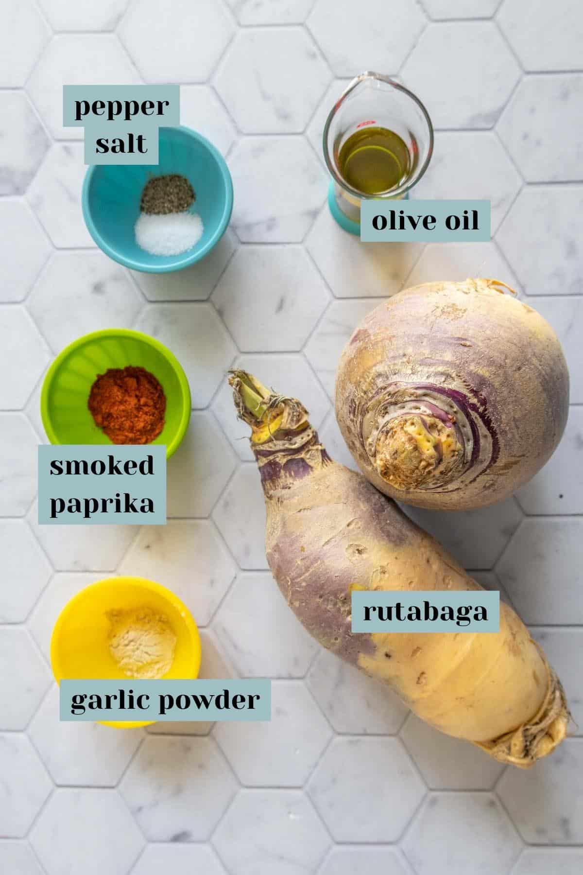 Ingredients for rutabaga fries on a tile surface with labels.