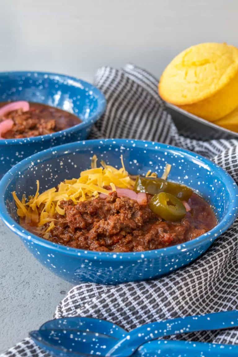 Blue enamel bowl of bison chili.