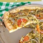 A slice of chicken pesto pizza with tomatoes and red onions is being lifted from a pan; text reads "chicken pesto pizza" and "packed with flavor." This chicken pesto pizza is perfect for a flavorful meal.