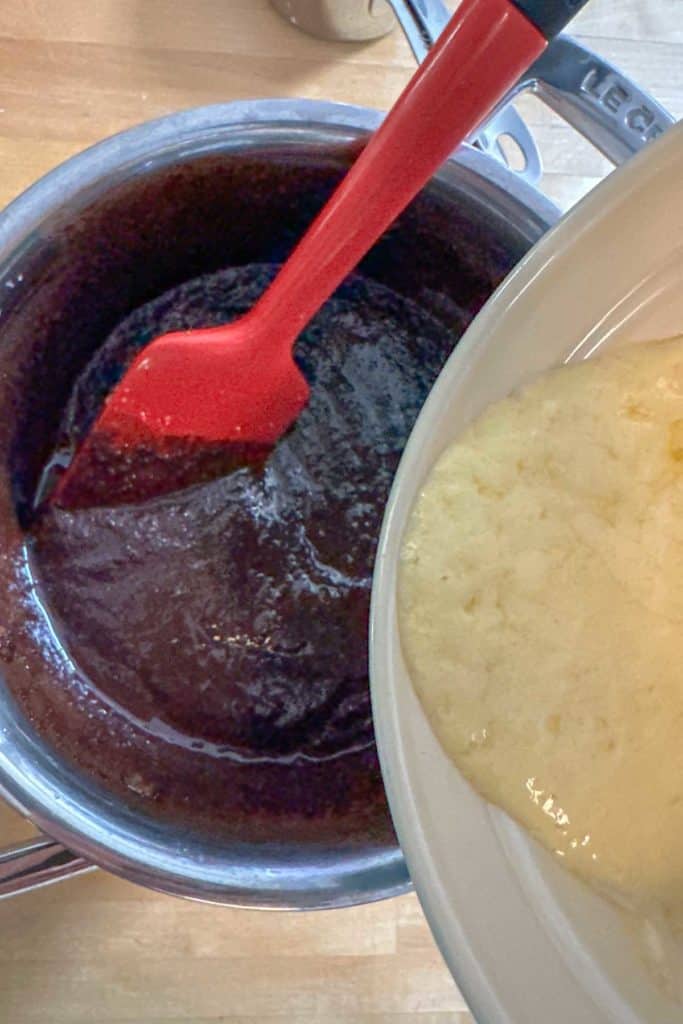 Adding yogurt mixture to brownie batter.