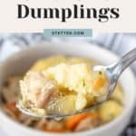 Slow cooker chicken and dumplings served in a bowl with a spoon.