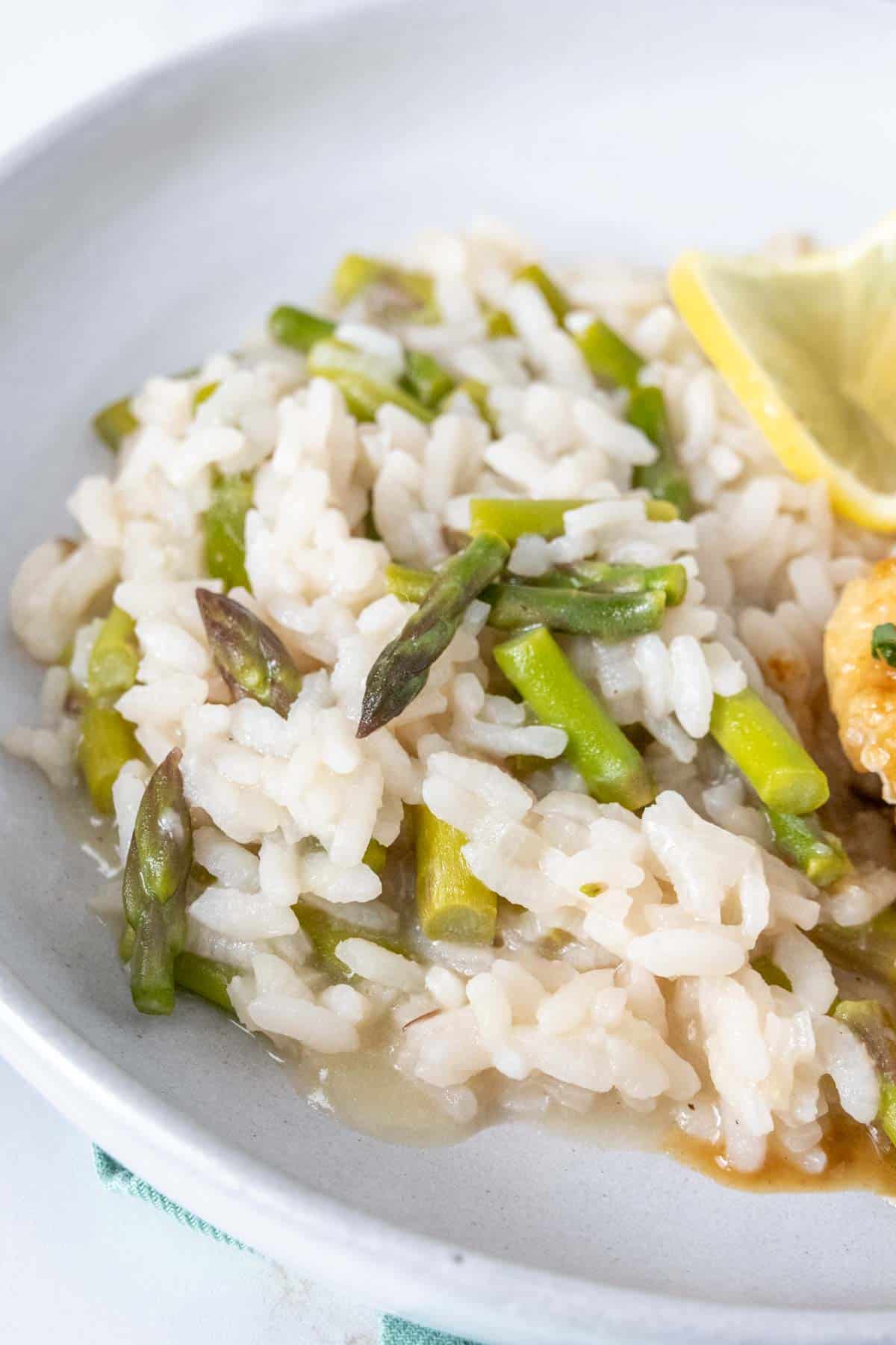 Asparagus risotto on a gray plate.