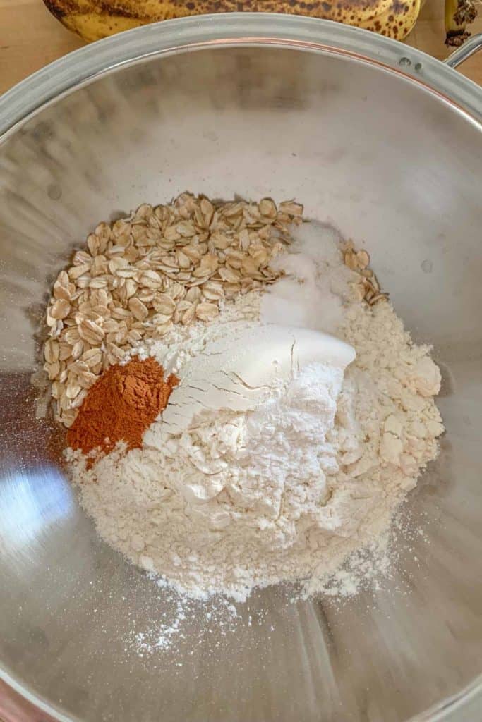 Dry ingredients for banana muffins in a mixing bowl.