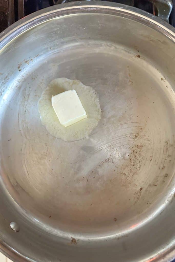 Melting butter in skillet.