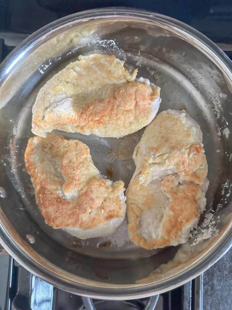 Cooking chicken on reverse side in saute pan.