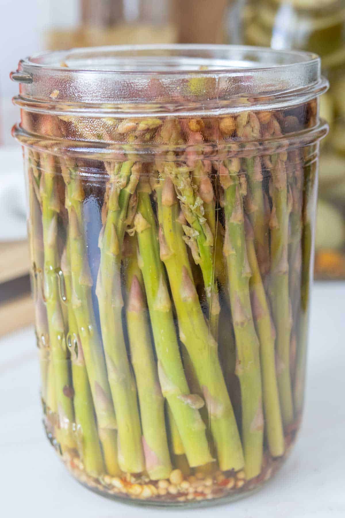 Jar of pickled asparagus.