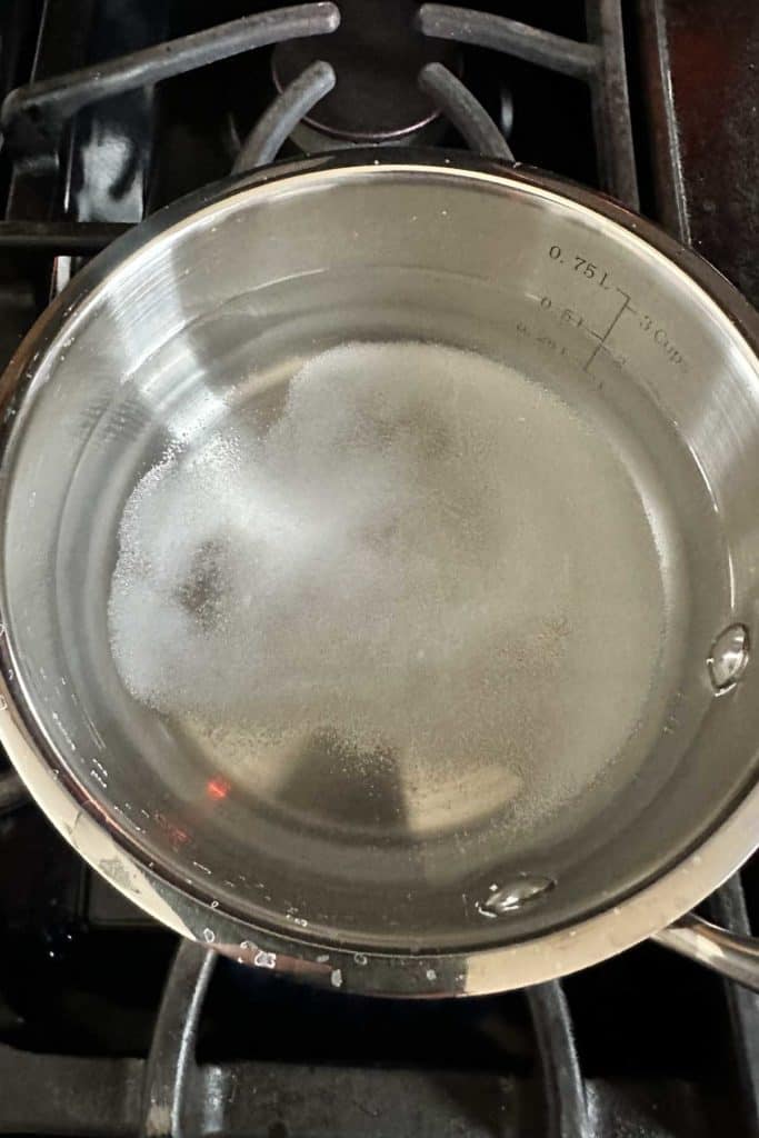 Pot of pickle brine being heated.