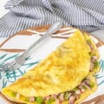 Denver omelet on a leaf patterned plate.