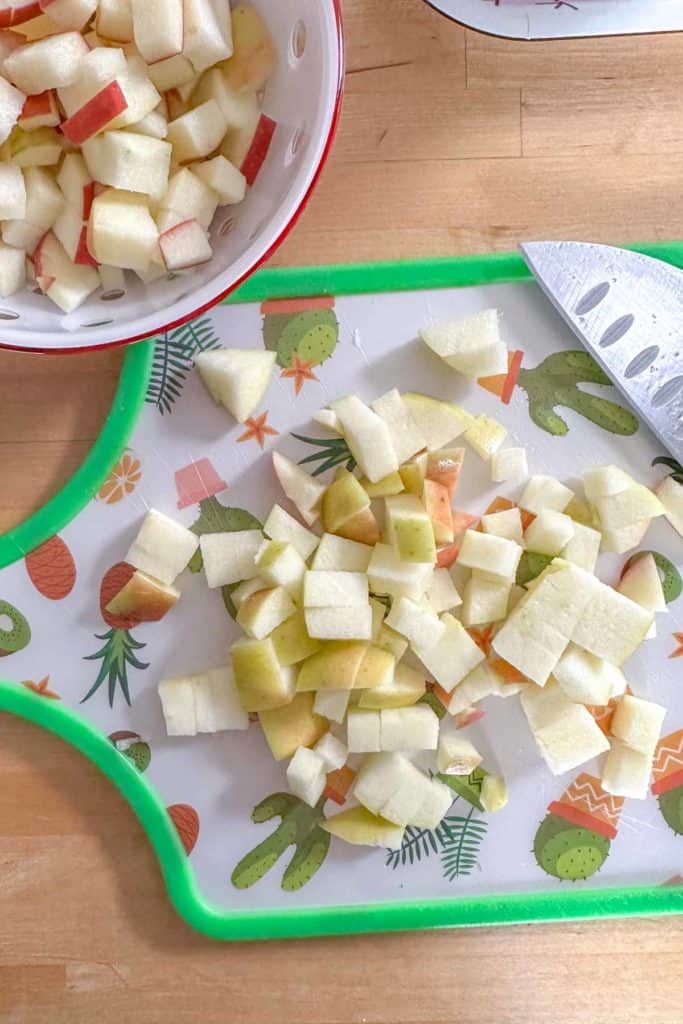Chopped apples on a cutting board.