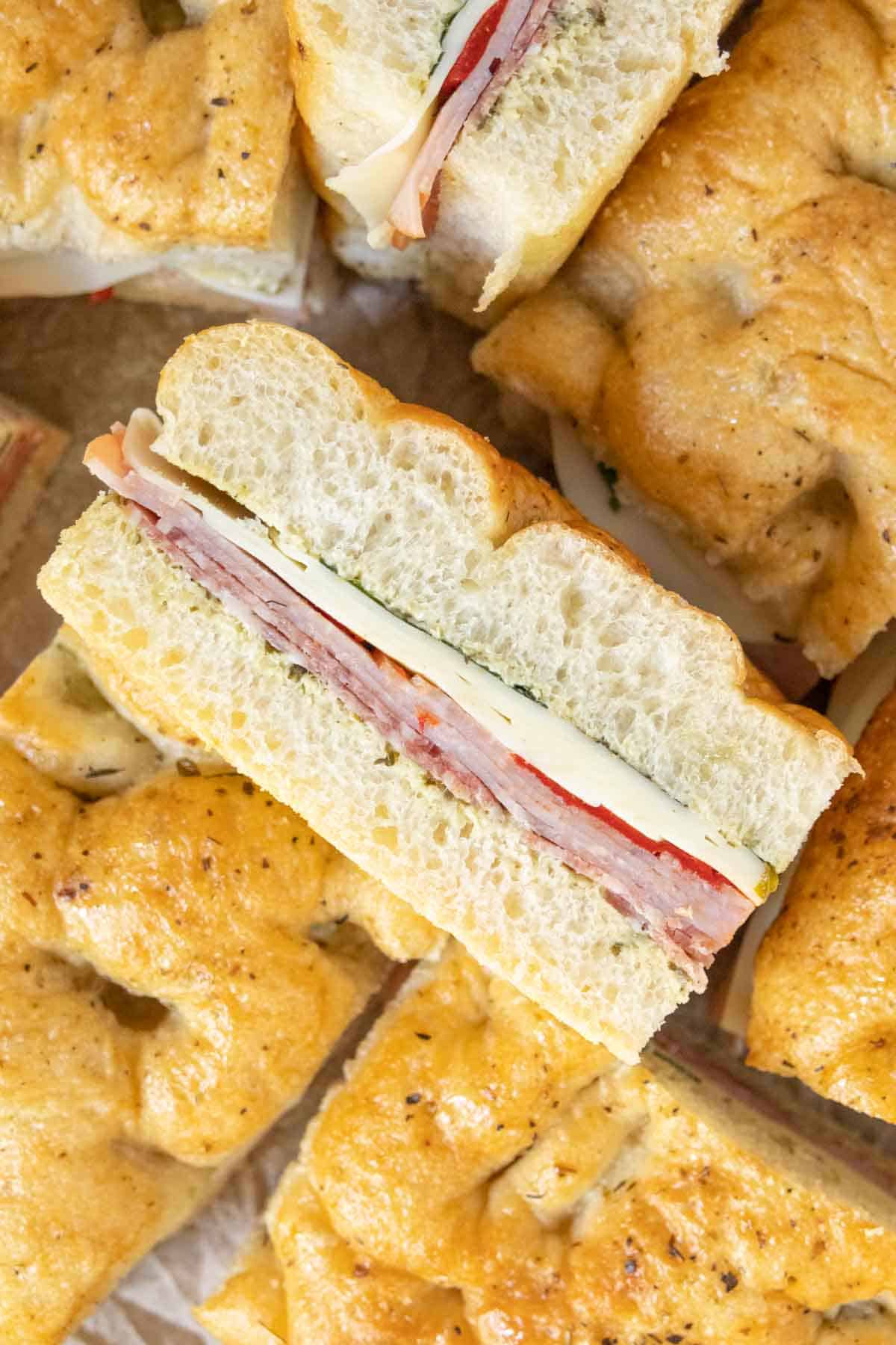 Close up overhead view of a pressed Italian sandwich, showing the layers.