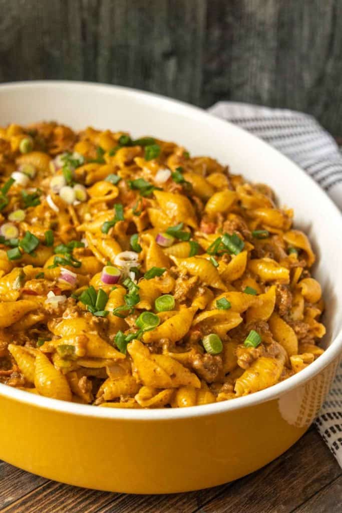 Casserole dish containing taco mac and cheese.