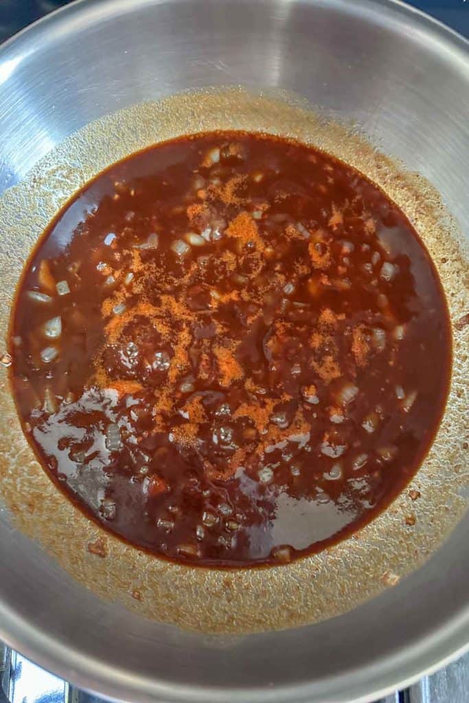 Baked bean sauce simmering in a pan.